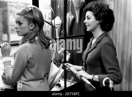 Catherine Deneuve & Anne Vernon Film: The Umbrellas Of Cherbourg; Les Parapluies De Cherbourg (Les parapluies de Cherbourg) Characters: Genevieve Emery & Madame Emery  Fr 1964, Director: Jacques Demy 19 February 1964   **WARNING** This Photograph is for editorial use only and is the copyright of PARC FILM and/or the Photographer assigned by the Film or Production Company and can only be reproduced by publications in conjunction with the promotion of the above Film. A Mandatory Credit To PARC FILM is required. The Photographer should also be credited when known. No commercial use can be granted Stock Photo