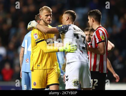 Coventry, UK. 19th Oct, 2022. Adam Davies of Sheffield Utd consoled by Ben Wilson of Coventry City during the Sky Bet Championship match at the Coventry Building Society Arena, Coventry. Picture credit should read: Darren Staples/Sportimage Credit: Sportimage/Alamy Live News Stock Photo