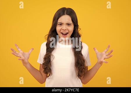 Child girl with angry expression. 12, 13, 14 year old teenager with angry face, upset emotions. Stock Photo