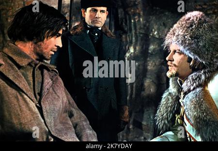 Alan Bates, Ian Holm & David Warner Film: The Fixer (1968) Characters: Yakov Bok,Grubeshov & Count Odoevsky  Director: John Frankenheimer 08 December 1968   **WARNING** This Photograph is for editorial use only and is the copyright of MGM and/or the Photographer assigned by the Film or Production Company and can only be reproduced by publications in conjunction with the promotion of the above Film. A Mandatory Credit To MGM is required. The Photographer should also be credited when known. No commercial use can be granted without written authority from the Film Company. Stock Photo