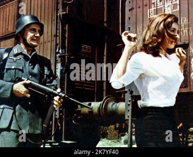 Trevor Howard & Raffaella Carra Film: Von Ryan'S Express (1965) Characters: Major Eric Fincham &  Director: Mark Robson 23 June 1965   **WARNING** This Photograph is for editorial use only and is the copyright of 20 CENTURY FOX and/or the Photographer assigned by the Film or Production Company and can only be reproduced by publications in conjunction with the promotion of the above Film. A Mandatory Credit To 20 CENTURY FOX is required. The Photographer should also be credited when known. No commercial use can be granted without written authority from the Film Company. Stock Photo