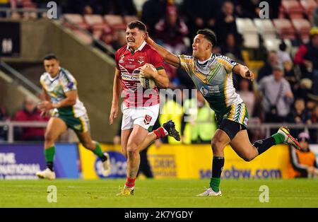 Tonga's Will Penisini (left) and Cook Islands' Kayal Iro in action