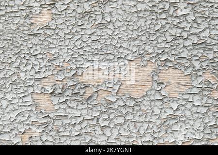 Pill of grey colored wall with cracks. Cracked weathered texture background Stock Photo