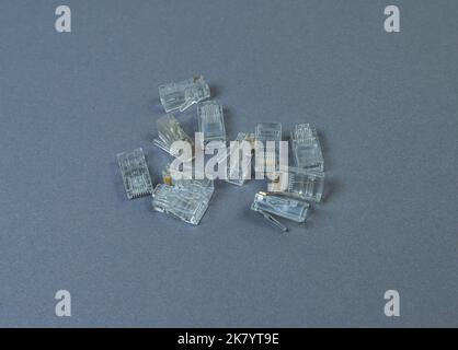 Many Connectors rj-45 close-up on grey white background isolate Stock Photo