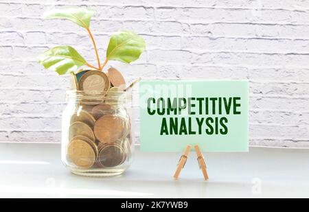 Notebook with Tools and Notes with text COMPETITOR ANALYSIS Stock Photo
