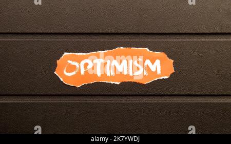 Optimism Word Written In red torn paper Stock Photo