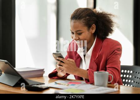African American businesswoman completes KYC using an online banking program in order to open a digital savings account. The definition of cyber Stock Photo