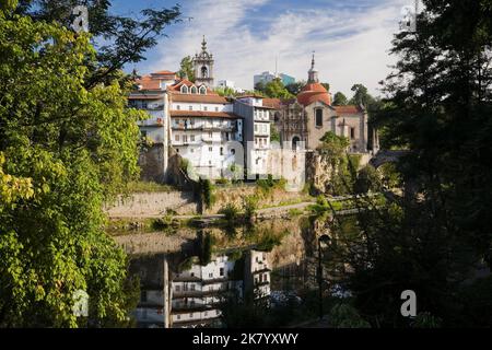 Historic buildings reflected in the Tamega river, Amarante, Portugal. Stock Photo