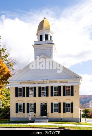 Manchester, VT - USA - Oct 9, 2022 Vertical image of the iconic Federal-style white brick Bennington County Courthouse; embellished by a large cupola Stock Photo