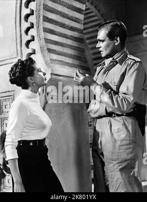 Albert Lieven & Yvonne De Carlo Film: Hotel Sahara (1951) Characters: Lt. Gunther von Heilicke, Yasmin Pallas  Director: Ken Annakin 12 October 1951   **WARNING** This Photograph is for editorial use only and is the copyright of UNITED ARTIST and/or the Photographer assigned by the Film or Production Company and can only be reproduced by publications in conjunction with the promotion of the above Film. A Mandatory Credit To UNITED ARTIST is required. The Photographer should also be credited when known. No commercial use can be granted without written authority from the Film Company. Stock Photo