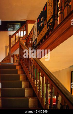 A staircase between floors at Cogswell's Grant in Essex, Massachusetts. Stock Photo