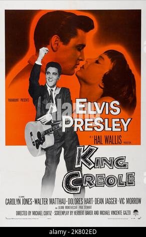 Elvis Presley & Carolyn Jones Poster Film: King Creole (USA 1958) Characters: Danny Fisher, Ronnie  Director: Michael Curtiz 02 July 1958   **WARNING** This Photograph is for editorial use only and is the copyright of PARAMOUNT and/or the Photographer assigned by the Film or Production Company and can only be reproduced by publications in conjunction with the promotion of the above Film. A Mandatory Credit To PARAMOUNT is required. The Photographer should also be credited when known. No commercial use can be granted without written authority from the Film Company. Stock Photo