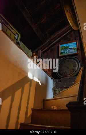 A staircase between floors at Cogswell's Grant in Essex, Massachusetts. Stock Photo