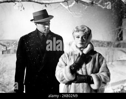 John Gavin & Lana Turner Film: Imitation Of Life (1959) Characters: Steve Archer, Lora Meredith  Director: Douglas Sirk 17 April 1959   **WARNING** This Photograph is for editorial use only and is the copyright of UNIVERSAL and/or the Photographer assigned by the Film or Production Company and can only be reproduced by publications in conjunction with the promotion of the above Film. A Mandatory Credit To UNIVERSAL is required. The Photographer should also be credited when known. No commercial use can be granted without written authority from the Film Company. Stock Photo