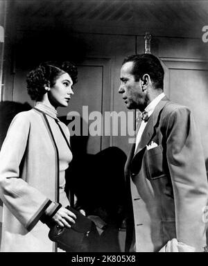 Marta Toren & Humphrey Bogart Film: Sirocco (1951) Characters: & Harry Smith  Director: Curtis Bernhardt 01 June 1951   **WARNING** This Photograph is for editorial use only and is the copyright of COLUMBIA PICTURES and/or the Photographer assigned by the Film or Production Company and can only be reproduced by publications in conjunction with the promotion of the above Film. A Mandatory Credit To COLUMBIA PICTURES is required. The Photographer should also be credited when known. No commercial use can be granted without written authority from the Film Company. Stock Photo