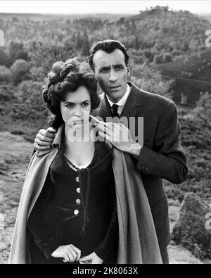 Marla Landi & Christopher Lee Film: The Hound Of The Baskervilles; Sherlock Holmes: The Hound Of The Baskervilles (UK 1959) Characters: Cecile Stapleton, Sir Henry  / Sherlock Holmes Verfilmung Director: Terence Fisher 04 May 1959   **WARNING** This Photograph is for editorial use only and is the copyright of HAMMER FILM and/or the Photographer assigned by the Film or Production Company and can only be reproduced by publications in conjunction with the promotion of the above Film. A Mandatory Credit To HAMMER FILM is required. The Photographer should also be credited when known. No commercial Stock Photo