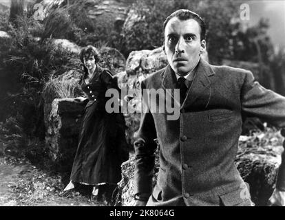 Marla Landi & Christopher Lee Film: The Hound Of The Baskervilles; Sherlock Holmes: The Hound Of The Baskervilles (UK 1959) Characters: Cecile Stapleton, Sir Henry  / Sherlock Holmes Verfilmung Director: Terence Fisher 04 May 1959   **WARNING** This Photograph is for editorial use only and is the copyright of HAMMER FILM and/or the Photographer assigned by the Film or Production Company and can only be reproduced by publications in conjunction with the promotion of the above Film. A Mandatory Credit To HAMMER FILM is required. The Photographer should also be credited when known. No commercial Stock Photo