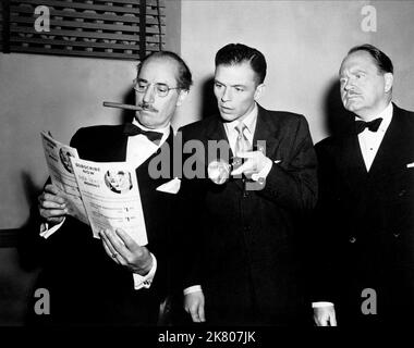 Groucho Marx, Howard Freeman & Frank Sinatra Film: Double Dynamite (1951) Characters: Emile J. Keck, R.B. Pulsifer Sr., Johnny Dalton  Director: Irving Cummings 25 December 1951   **WARNING** This Photograph is for editorial use only and is the copyright of RKO and/or the Photographer assigned by the Film or Production Company and can only be reproduced by publications in conjunction with the promotion of the above Film. A Mandatory Credit To RKO is required. The Photographer should also be credited when known. No commercial use can be granted without written authority from the Film Company. Stock Photo