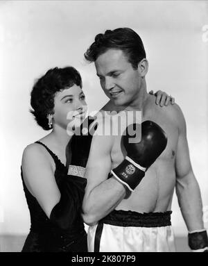 Leslie Caron & Ralph Meeker Film: Glory Alley (1952) Characters: Angela Evans, Socks Barbarrosa  Director: Raoul Walsh 06 June 1952   **WARNING** This Photograph is for editorial use only and is the copyright of MGM and/or the Photographer assigned by the Film or Production Company and can only be reproduced by publications in conjunction with the promotion of the above Film. A Mandatory Credit To MGM is required. The Photographer should also be credited when known. No commercial use can be granted without written authority from the Film Company. Stock Photo