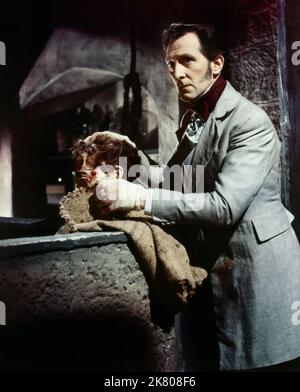 Peter Cushing Film: The Curse Of Frankenstein (1959) Characters: Victor Frankenstein  Director: Terence Fisher 02 May 1957   **WARNING** This Photograph is for editorial use only and is the copyright of HAMMER FILM and/or the Photographer assigned by the Film or Production Company and can only be reproduced by publications in conjunction with the promotion of the above Film. A Mandatory Credit To HAMMER FILM is required. The Photographer should also be credited when known. No commercial use can be granted without written authority from the Film Company. Stock Photo