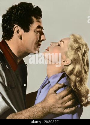 Victor Mature & Janet Leigh Film: Safari (USA/UK 1956) Characters: Ken Duffield & Linda Latham  Director: Terence Young 20 June 1956   **WARNING** This Photograph is for editorial use only and is the copyright of WARWICK FILM PRODUCTIONS and/or the Photographer assigned by the Film or Production Company and can only be reproduced by publications in conjunction with the promotion of the above Film. A Mandatory Credit To WARWICK FILM PRODUCTIONS is required. The Photographer should also be credited when known. No commercial use can be granted without written authority from the Film Company. Stock Photo