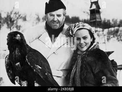 Jack Warner & Nadia Gray Film: Valley Of Eagles (1952) Characters: Inspector Peterson & Kara Niemann  Director: Terence Young 26 September 1951   **WARNING** This Photograph is for editorial use only and is the copyright of The Film Company and/or the Photographer assigned by the Film or Production Company and can only be reproduced by publications in conjunction with the promotion of the above Film. A Mandatory Credit To The Film Company is required. The Photographer should also be credited when known. No commercial use can be granted without written authority from the Film Company. Stock Photo