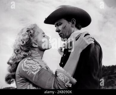 Jan Harrison & Ben Johnson Film: Fort Bowie (USA 1958) Characters: Alison Garrett & Capt. Thomas Thompson  Director: Howard W. Koch 01 February 1958   **WARNING** This Photograph is for editorial use only and is the copyright of UNITED ARTISTS and/or the Photographer assigned by the Film or Production Company and can only be reproduced by publications in conjunction with the promotion of the above Film. A Mandatory Credit To UNITED ARTISTS is required. The Photographer should also be credited when known. No commercial use can be granted without written authority from the Film Company. Stock Photo