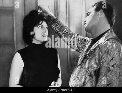 Anna Magnani & Marlon Brando Film: The Fugitive Kind (USA 1959) Characters: Lady Torrance & Valentine 'Snakeskin' Xavier  Director: Sidney Lumet 14 April 1959   **WARNING** This Photograph is for editorial use only and is the copyright of UNITED ARTISTS and/or the Photographer assigned by the Film or Production Company and can only be reproduced by publications in conjunction with the promotion of the above Film. A Mandatory Credit To UNITED ARTISTS is required. The Photographer should also be credited when known. No commercial use can be granted without written authority from the Film Company Stock Photo