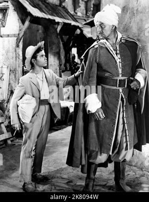 Dean Stockwell & Errol Flynn Film: Kim (1952) Characters: Kim & Mahbub Ali, the Red Beard  Director: Victor Saville 07 December 1950   **WARNING** This Photograph is for editorial use only and is the copyright of MGM and/or the Photographer assigned by the Film or Production Company and can only be reproduced by publications in conjunction with the promotion of the above Film. A Mandatory Credit To MGM is required. The Photographer should also be credited when known. No commercial use can be granted without written authority from the Film Company. Stock Photo