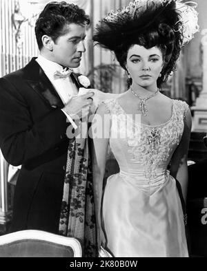 Farley Granger & Joan Collins Film: The Girl In The Red Velvet Swing (1955) Characters: Harry Kendall Thaw & Evelyn Nesbit  Director: Richard Fleischer 01 October 1955   **WARNING** This Photograph is for editorial use only and is the copyright of 20TH CENTURY FOX and/or the Photographer assigned by the Film or Production Company and can only be reproduced by publications in conjunction with the promotion of the above Film. A Mandatory Credit To 20TH CENTURY FOX is required. The Photographer should also be credited when known. No commercial use can be granted without written authority from the Stock Photo