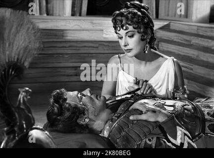 Massimo Serato & Hedy Lamarr Film: Loves Of Three Queens; The Face That Launched A Thousand Ships; L'Amante Di Paride (1954) Characters: Paris, Helen of Troy  Director: Marc Allegret 24 December 1954   **WARNING** This Photograph is for editorial use only and is the copyright of CINE DEL DUCO and/or the Photographer assigned by the Film or Production Company and can only be reproduced by publications in conjunction with the promotion of the above Film. A Mandatory Credit To CINE DEL DUCO is required. The Photographer should also be credited when known. No commercial use can be granted without Stock Photo