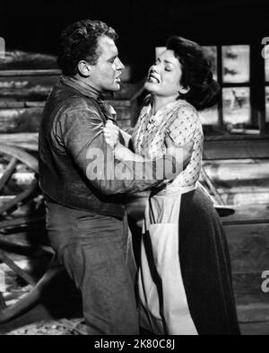 Rod Steiger & Valerie French Film: Jubal (1955) Characters: 'Pinky' Pinkum, Mae Horgan  Director: Delmer Daves 06 April 1956   **WARNING** This Photograph is for editorial use only and is the copyright of COLUMBIA and/or the Photographer assigned by the Film or Production Company and can only be reproduced by publications in conjunction with the promotion of the above Film. A Mandatory Credit To COLUMBIA is required. The Photographer should also be credited when known. No commercial use can be granted without written authority from the Film Company. Stock Photo