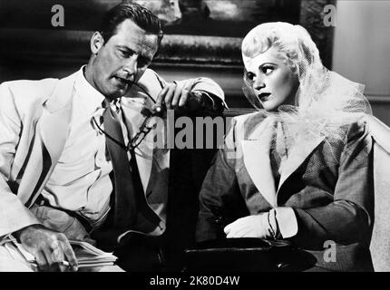 William Holden & Judy Holliday Film: Born Yesterday (USA 1950) Characters: Paul Verrall, Emma 'Billie' Dawn  Director: George Cukor 25 December 1950   **WARNING** This Photograph is for editorial use only and is the copyright of COLUMBIA and/or the Photographer assigned by the Film or Production Company and can only be reproduced by publications in conjunction with the promotion of the above Film. A Mandatory Credit To COLUMBIA is required. The Photographer should also be credited when known. No commercial use can be granted without written authority from the Film Company. Stock Photo