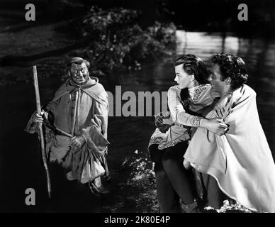 James Hayter, Joan Rice & Richard Todd Film: The Story Of Robin Hood And His Merrie Men (USA/UK 1952) Characters: Friar Tuck, Maid Marian, Robin Hood  / Titel Auch: 'Robin Hood, Rebell Des Königs' Director: Ken Annakin 13 March 1952   **WARNING** This Photograph is for editorial use only and is the copyright of RKO and/or the Photographer assigned by the Film or Production Company and can only be reproduced by publications in conjunction with the promotion of the above Film. A Mandatory Credit To RKO is required. The Photographer should also be credited when known. No commercial use can be gra Stock Photo