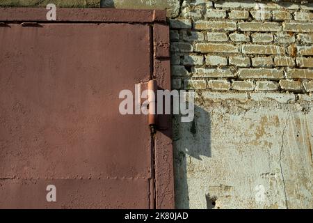 Steel gates. Loop on gate. Details of industrial building. Door hinge. Details of building. Stock Photo