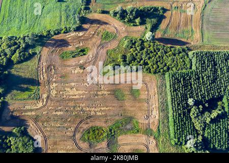 Crop fields, sinkholes and groves in nature park, Lithuania, aerial view Stock Photo