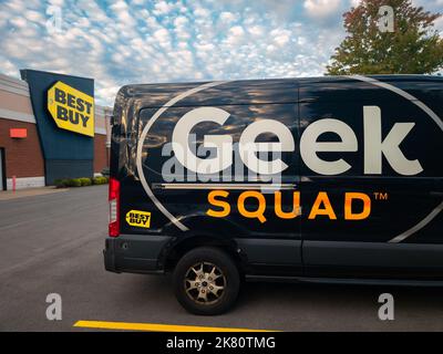 New Hartford, New York - Oct 1, 2022: Landscape Wide View of Geek Squad Black Van in foreground and Best Buy Building in Background. Stock Photo