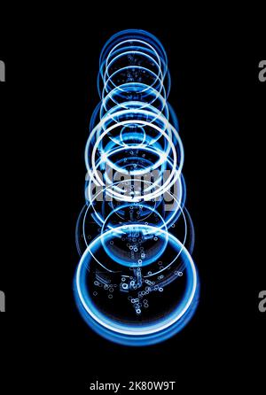 Whirling light circles on blakc backgrond Stock Photo