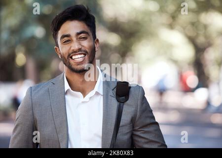 Todays going to be a good day. a young businessman standing in the city. Stock Photo