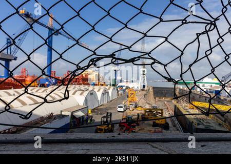 Harbor and the Bay of Gibraltar with its colorful rail cranes, containers, ships and boats. Stock Photo