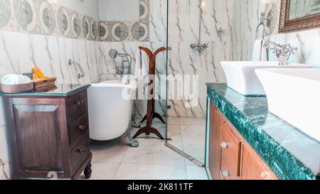 Bathroom of a room at Baber Mahal Vilas which includes a freestanding claw bath Stock Photo