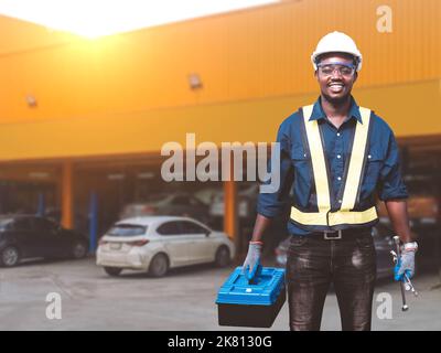 African engineer technician maintenance man checking car with use tools and wrench  , service via insurance system at Auomobile repair and check up ce Stock Photo