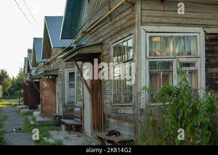 Old houses in countryside. Barracks in ghetto. Housing for poor. Dilapidated buildings. Poor housing in Russia. Stock Photo