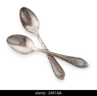 Top view of two old silver teaspoons isolated on white Stock Photo
