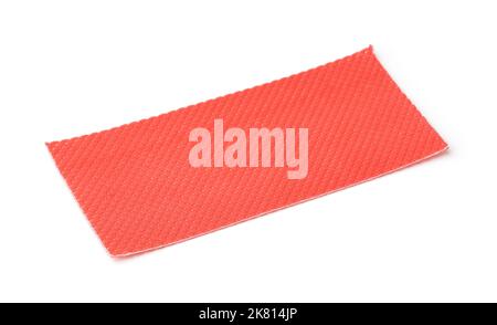 Piece of red plastic perforated packaging underlayment isolated on white Stock Photo