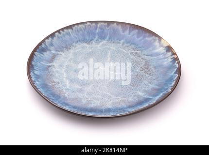 Empty blue handmade ceramic plate isolated on white Stock Photo