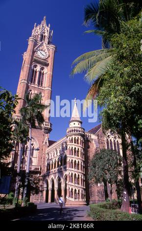 India: The Rajabai Clock Tower and the university library, University of Mumbai, Fort campus, Mumbai, built in so-called‚ Bombay Gothic style. The University of Bombay, as it was originally known, was established in 1857. The Rajabai Tower and library building were designed by Sir George Gilbert Scott and completed in 1878. Stock Photo