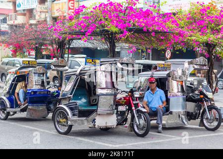 Tricycles at a terminal in Vigan City, Philippines Stock Photo