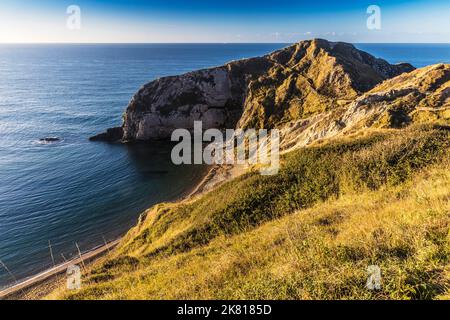 View over Man O'War Beach in Dorset looking west at sunrise. Stock Photo