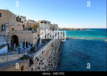 View north from Torre Matta over rampart and houses next to Otranto harbour, Apulia (Puglia), Italy. Stock Photo